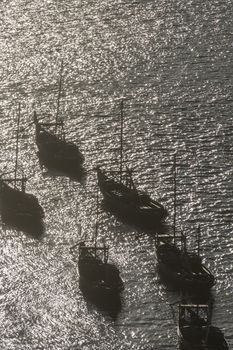 the port wine Boats at the waterfront with the old town on the Douro River in Ribeira in the city centre of Porto in Porugal in Europe.