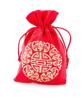 Red fabric bag or ang pow with Chinese style pattern on white background.