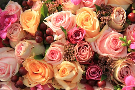 Pastel roses in different shades of pink in a bridal arrangement