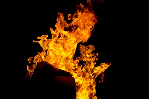 Photo of red fire flame on black background