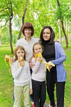 Photo of group people are eating bananas