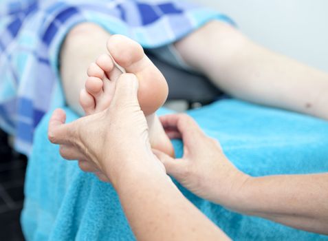 Massage of feet by pedicure