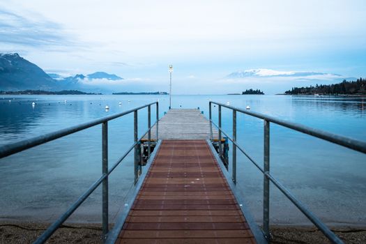 Walkway over the Lake Garda at first light.