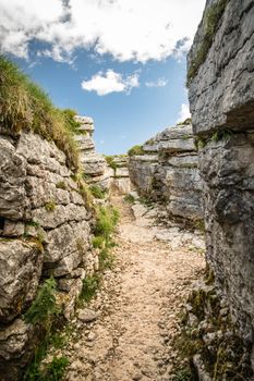 Trench dug in the rock dating back to World War I located on the Italian alps.