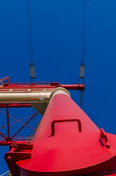 supports of high-voltage power lines against the blue sky