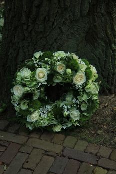 Sympathy wreath near a tree