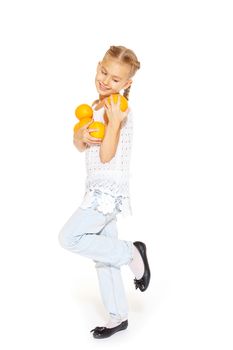 Beauty young girl with fresh oranges. Healthy lifestyle. Happiness. White background.