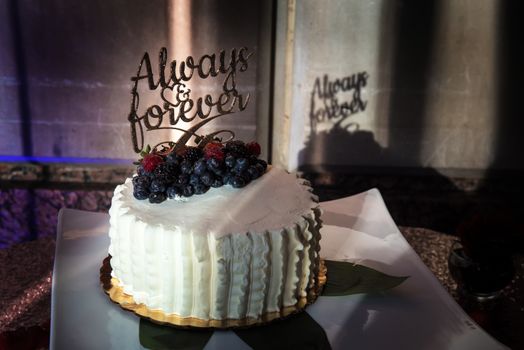 image of a wdding cake that says always and forever
