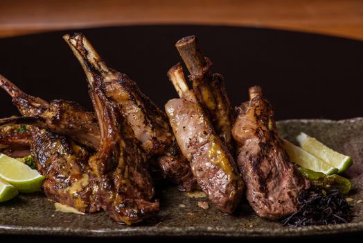 Image of freshly grilled lamb chops with lime garnish