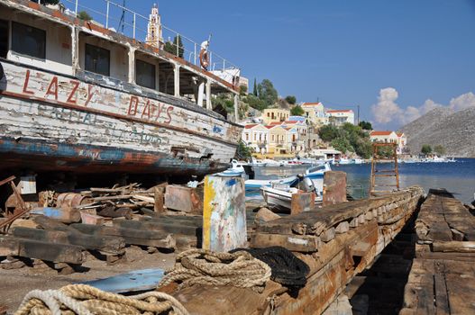 This old boatyard is at the arboursside in Gialos ( the lower harbour town )above which is Chorio ( the upper town ) together they form Symi town on the Greek island of Symi, near Rhodes in the Mediterranean sea. 