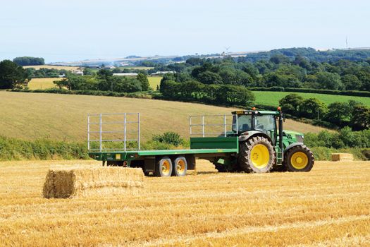 Pastoral scene.
Summer in England .The corn is gathered in and the balesof hay are made.