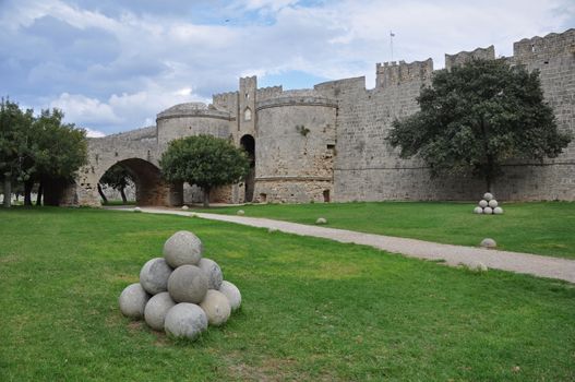 The dry moat encircles the ancient walled Rhodes City, on the Greek island of Rhodes