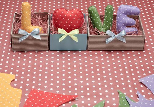 Love, Valentines Day. Word Love polka dots, Heart Handmade in gift boxes, ribbons. Retro vintage romantic style, toned. Vivid unusual creative art greeting card, multicolored felt, present, copyspace