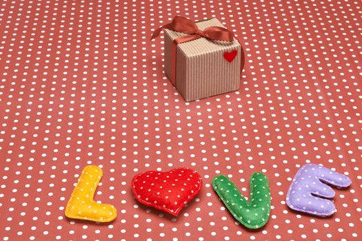 Love, Valentines Day. Word Love polka dots, Heart Handmade and gift box, ribbon. Retro vintage romantic style, toned. Vivid unusual creative art greeting card, multicolored felt, present, copyspace