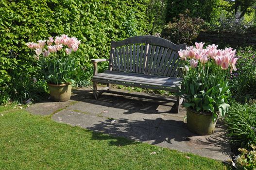 Garden furniture an English style garden. Taken at RHS Rosemoor, Torrington, North Devon, England