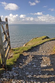 Southwest Coast footpath at Baggy Point headland, Croyde, North Devon, England, a popular walk throughout the year, ths Island of Lundy is visible on the horizon