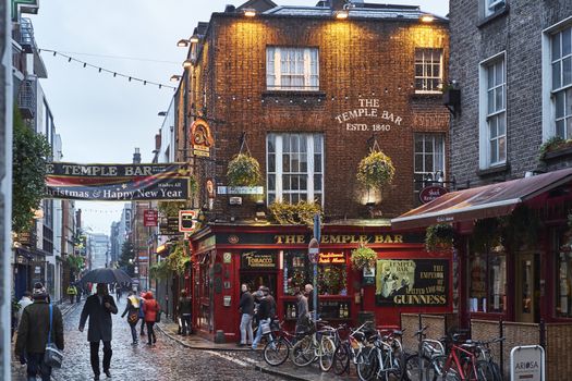DUBLIN, IRELAND - JANUARY 05: Street in Temple Bar during rainy evening. The area is the heart of tourism in the city. January 05, 2016 in Dublin