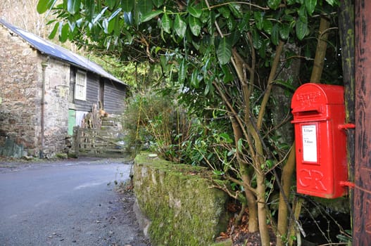 An English village post box. Taken in the village  of Belstone, on the northern edge of Dartmoor in Devon - A standard Royal Mail design used throughout the UK. 