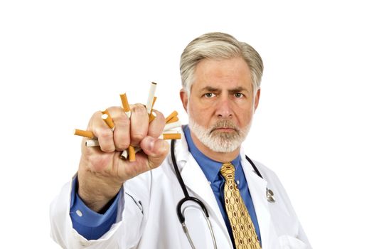 Doctor crushing cigarettes showing not to smoke.