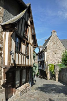 Medieval half-timbered buildings in the ancient french town of Dinan in Brittany. These old houses are in the Rue de Jerzual, which leads into the Rue du Petit Port and then to the River Rance ~ probably the street most visited by tourists