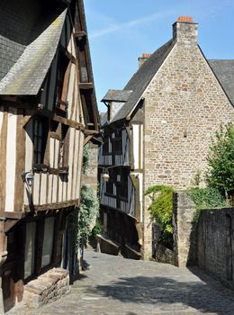 Medieval half-timbered buildings in the ancient french town of Dinan in Brittany. These old houses are in the Rue de Jerzual, which leads into the Rue du Petit Port and then to the River Rance ~ probably the street most visited by tourists