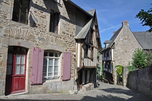 Medieval half-timbered buildings in the ancient french town of Dinan in Brittany. These old houses are in the Rue de Jerzual, which leads into the Rue du Petit Port and then to the River Rance ~ probably the street most visited by tourists