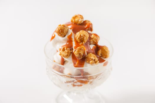 Vanilla ice cream with pop corn and Thai tea caramel sauce