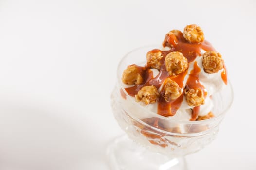 Vanilla ice cream with pop corn and Thai tea caramel sauce
