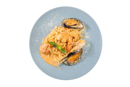 pasta with mussels, shrimp, scallop dressed with Thai style spicy sauce (Tom Yum)