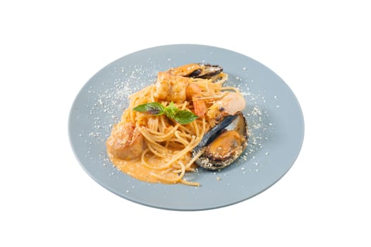 pasta with mussels, shrimp, scallop dressed with Thai style spicy sauce (Tom Yum)