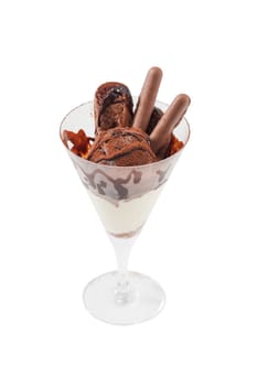 Vanilla ice cream with chocolate topping and chocolate wafer in cocktail glass isolated on white background with clipping path