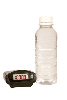 Pedometer reading the walking goal of 10,000 and a water bottle.