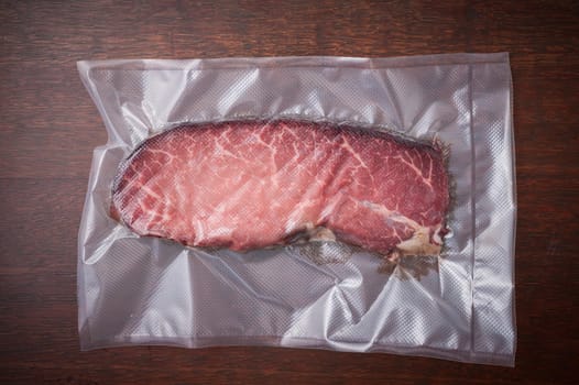 Dry-aged beef in plastic seal package