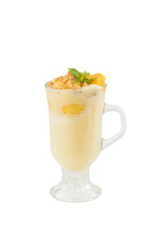 Mango cobbler shale, Mango milk shake with bits og mango and crackers isolated on white background with clipping path