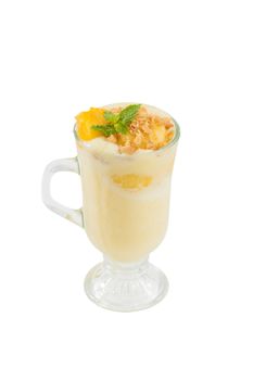 Mango cobbler shale, Mango milk shake with bits og mango and crackers isolated on white background with clipping path
