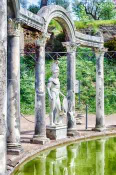 Greek Statue of Ares overlooking the ancient pool called Canopus, inside Villa Adriana (Hadrian's Villa), Tivoli, Italy