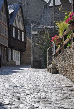 Medieval half-timbered buildings in the ancient french town of Dinan in Brittany. These old houses are in the Rue de Jerzual, which leads into the Rue du Petit Port and then to the River Rance. Probably the street most visited by tourists