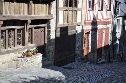 Medieval half-timbered buildings in the ancient french town of Dinan in Brittany. These old houses are in the Rue de Jerzual, which leads into the Rue du Petit Port and then to the River Rance.