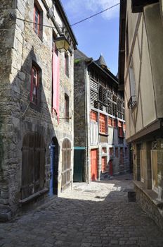 Medieval buildings in the ancient french town of Dinan in Brittany. These old houses are in the Rue du Petit Port which leads to the River Rance and port area of the town.