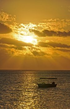 The tranquil beaches of the  South Pacific Ocean really are paradise found. This sunset is over the Coral Coast on the island of Viti Levu (Fiji)