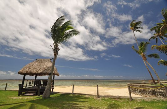 The tranquil beaches of the  South Pacific Ocean really are paradise found. This thatched beach hut overlooks the Coral Coast on the island of Viti Levu (Fiji)