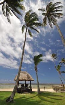 The tranquil beaches of the  South Pacific Ocean really are paradise found. This thatched beach hut overlooks the Coral Coast on the island of Viti Levu (Fiji)