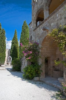 Cloisters and decorated well, at Ialyssos monastery on the Greek island of Rhodes is built at the top of Mount Filerimos