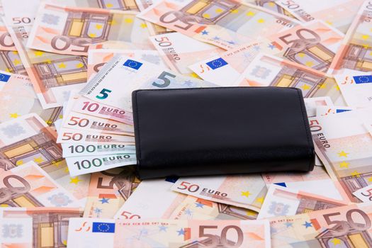 Black wallet with European money