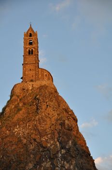 The Chapel built on the top of a needle of volcanic lava, called Rocher St Michel ( Mont d'Aiguilhe ) is one of the most impressive sights in the Auvergne, France