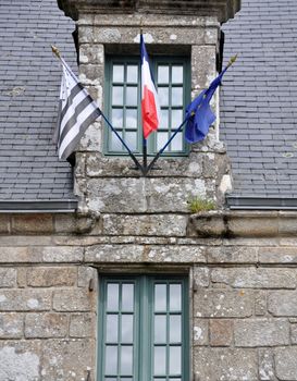 Trio of flags in France, the EU, France, and Brittany flags