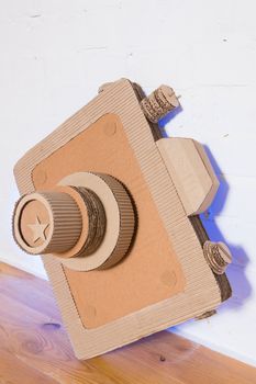 handmade cardboard camera on a white background