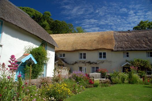 A group of pretty traditional English thatched cottages in the North Devon village of Georgeham, near Croyde