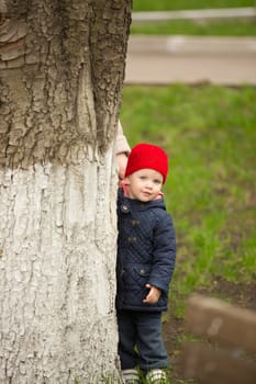 cute little girl playing in the park in spring