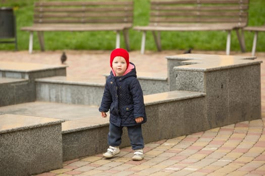 cute little girl playing in the park in spring